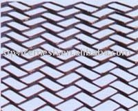Herringbone shaped metal plate mesh